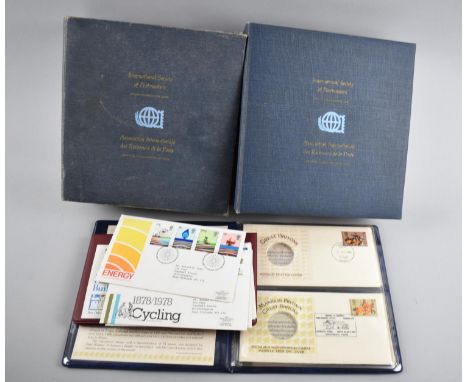 Two Ring Binders Containing First Day Cover Coin Holders, missing coins but with stamps 