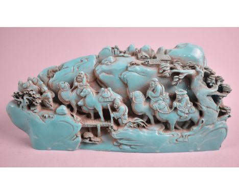A Reproduction Chinese Hardstone Boulder Decorated with Mounted Figures on Camels, 25cm high 