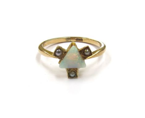 A 9ct gold opal and pearl ring with trillion cut opal to centre and seed pearl set to each side. Size P, 2.4g