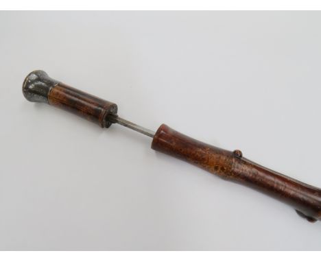 A Victorian bamboo swordstick with white metal top