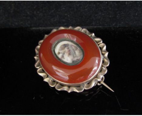 A memoriam brooch with cornelian panel and miniature portrait to centre, monogrammed to reverse LER, 7.2g