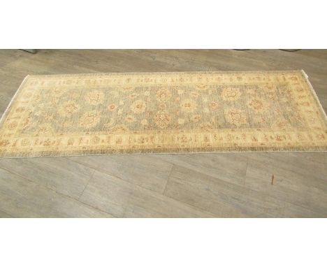 A wool beige and light grey runner rug with foliate design, 235cm x 74cm