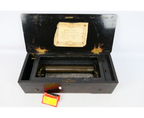 A 19th Century Swiss music cylinder box by J.M & Co St Croix, the case with inlaid decoration, maker's card to the interior s
