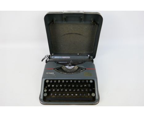 Hermes - A Hermes 1940s vintage Baby type writer - The typewriter which is in its metal case appears in overall good conditio