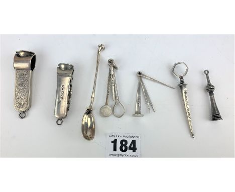Silver cigar cutters, silver spoon and silver tobacco tools and other tools