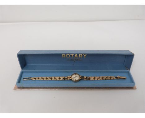 A vintage 9ct gold ladies Rotary 21 Jewels cocktail watch in original Rotary box. The watch has a round face with an articula