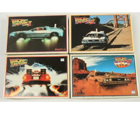 Aoshima Back to the Future 1:24 scale plastic model kits x4, to include The Delorean Time Machine from Part I, II, III, unmad