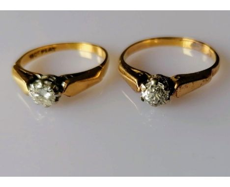 Two mid-20th century solitaire diamond rings in claw settings, each stone approximately 0.2 carats, sizes K, P, one stamped 1