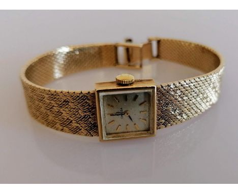 A mid-century ladies 9ct gold Omega manual bracelet watch with square champagne dial, 14mm, raised black hands and batons, te