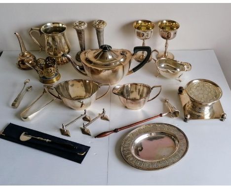 A selection of silver plated items to include a three-piece Unity Plate tea service, goblets, wine funnel, tongs, flatware, e