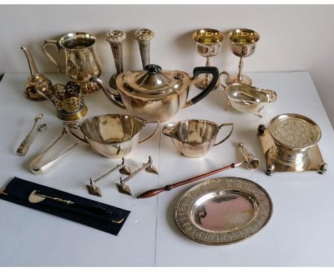 A selection of silver plated items to include a three-piece Unity Plate tea service, goblets, wine funnel, tongs, flatware, e