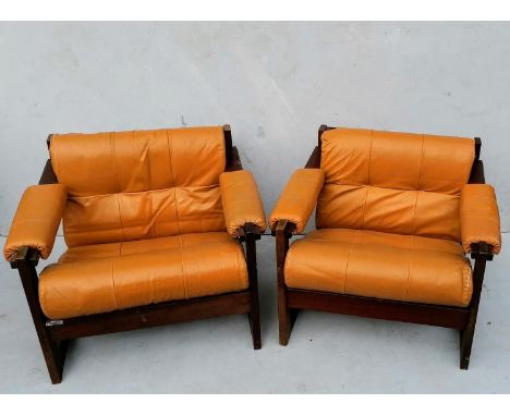 A pair of Percival Lafer lounge chairs with hardwood frames and leather upholstery, labelled Lafer S.A. Brazil, c. 1958, 67 x