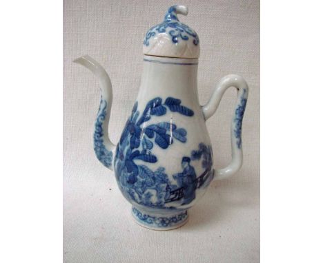 An eighteenth century Chinese coffee pot of typical form with S scroll spout and shaped loop handle, decorated in underglaze 
