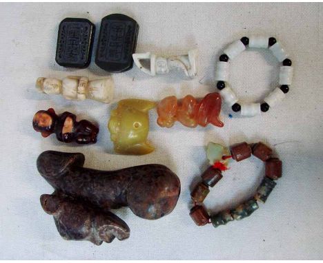 A collection of ten Chinese jade/hardstone buckles, fertility symbols, ornaments and bracelets, 5cm to 13.5cm (10)