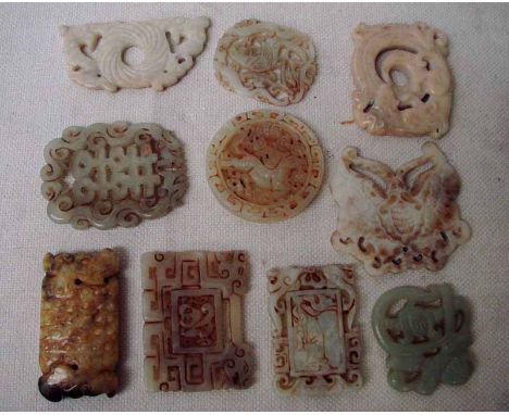 A collection of ten Chinese jade/hardstone pendants in various designs, 4cm to 6cm 