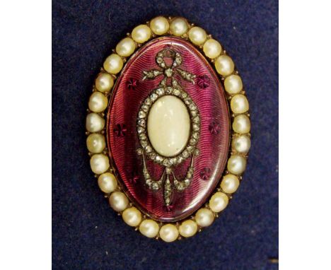 A late 19th century continental brooch, yellow metal of oval form with split pearl border around a mauve coloured enamel guil