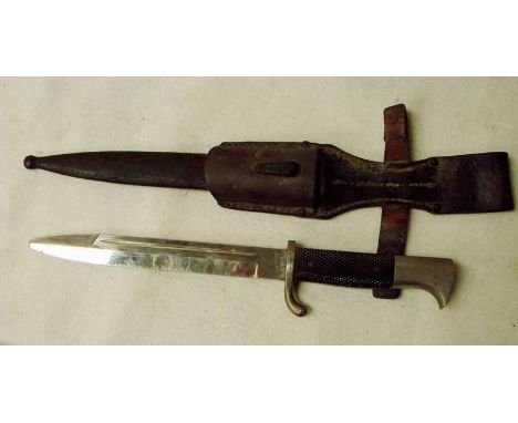 A German Third Reich Dress Bayonet, fullered single edge blade stamped WKC, scroll quillion, plastic grips, birds head pommel