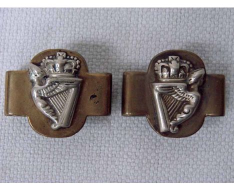 5th Royal Irish Lancers Officer's Stirrup Slips.  A pair of brass stirrup slips with silver Maid of Erin harp surmounted by a