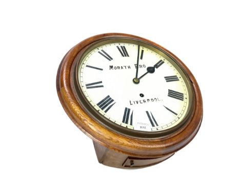 EARLY 20TH CENTURY WALL CLOCK BY MORATH BROS., of Liverpool, single train movement, the white enamel dial with Roman numerals