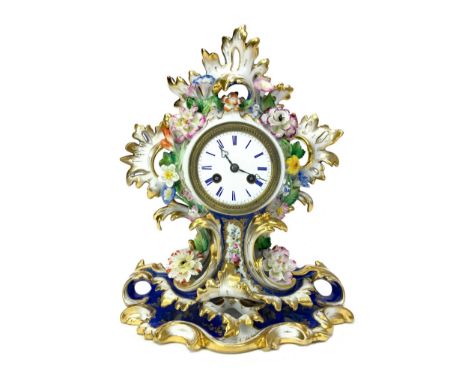 LATE 19TH CENTURY FRENCH PORCELAIN MANTEL CLOCK, with two train movement, the white enamel dial with Roman numerals, containe