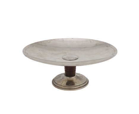 circular form, with incised borders, a central boss and the spreading foot with a turned rosewood support, by Goldsmiths & Si