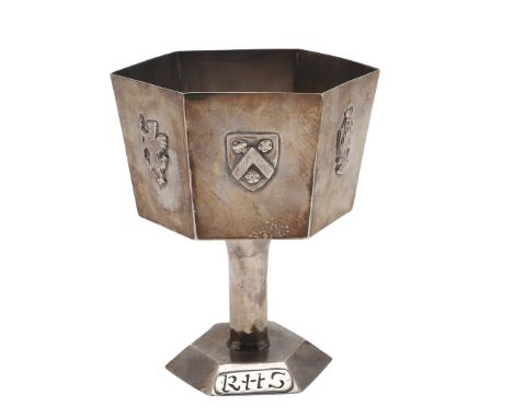 hexagonal form, with various applied motifs on each panel and the foot with the applied plaque bearing the initials "RHS", de