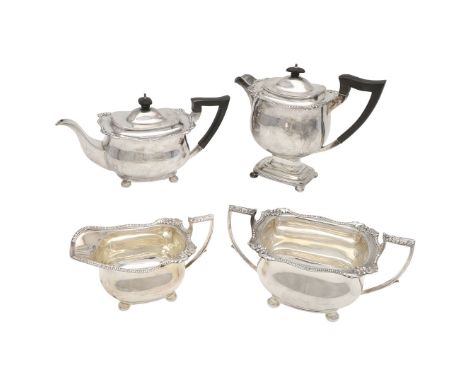 with plain rounded bodies, egg & dart borders with shell corners and raised on bun feet, teapot inscribed,  by Mappin & Webb 