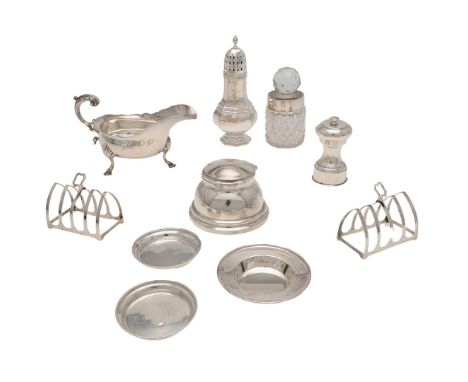 to include a pair of toast racks, an inkwell (loaded base), a sauce boat, a glass mounted bottle, a pepper grinder, a sugar c