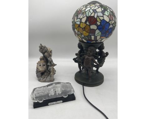 Tiffany Stile Bronzed Resin Table Lamp with Three Cherubs, Hofbauer Glass BMW 635 CSi, and Owl in the Tree Figure. 