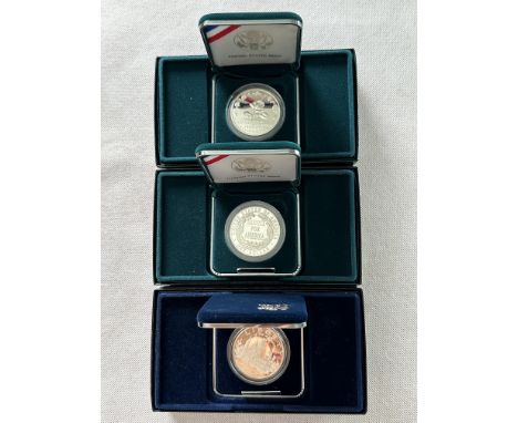 Three Boxed United State Mint Proof Silver Dollar Commemorative Coins. 