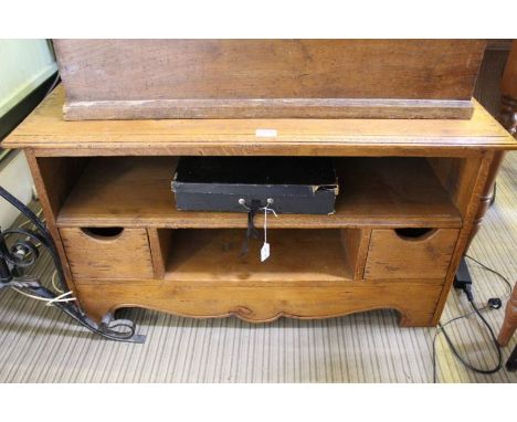 A light oak audiovisual stand, for a large television