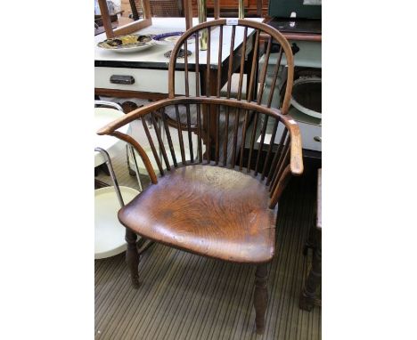 A 19th century double comb back chair, with well figured elm seat