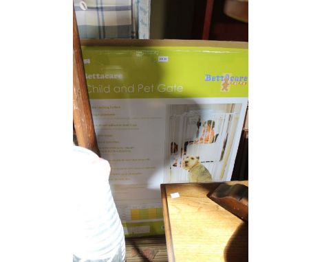 A boxed Bettercare Stair gate