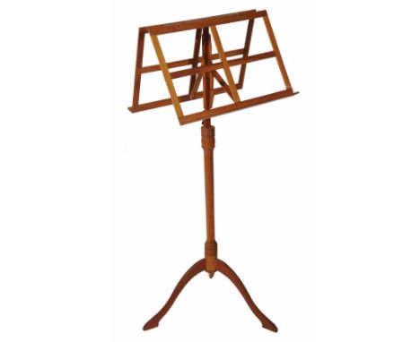 A WOODEN DUET MUSIC STAND made by Donald Gill with height adjustable mechanism and turned column, shaped tripod, 109cm high a