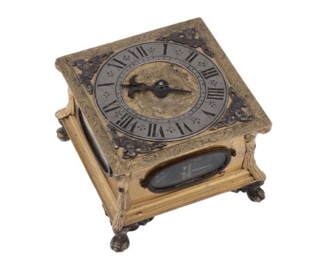 A fine Lithuanian engraved gilt brass horizontal striking table clock signed...   A fine Lithuanian engraved gilt brass horiz