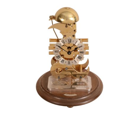 A brass and silver limited edition skeleton timepiece 'The Money Clock   A brass and silver limited edition skeleton timepiec