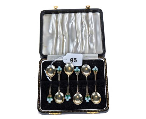 A SET OF SIX ENGLISH SILVER AND ENAMEL COFFEE SPOONS with flower head terminals, maker T &amp; S, Birmingham 1927, boxed, app