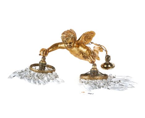 AN EARLY 20TH CENTURY GILDED GESSO CHERUB LIGHT FITTING, each arm with brass fitting and icicle drops, 13 ins long.   £50-£75