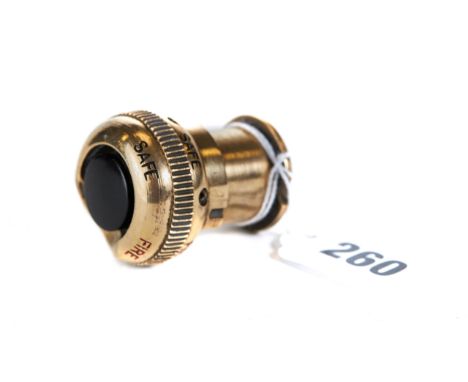A WWII BRASS SPITFIRE MACHINE GUN FIRING BUTTON, with fire/safe setting.   £200-£300