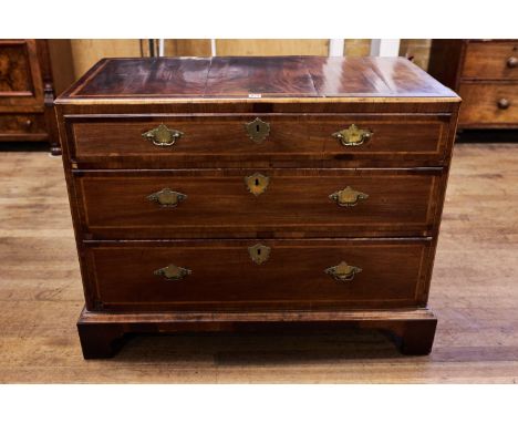 AN EARLY 18TH CENTURY WALNUT AND HERRINGBONE BANDED CHEST OF DRAWERS, three long graduated drawers, on bracket feet, 40 ins w