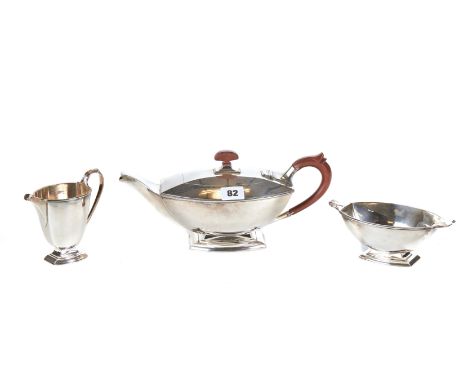 AN ART DECO DESIGN THREE PIECE SILVER TEA SET, comprising:- Teapot, cream jug and sugar basin, maker:- A. Bros Ltd, Birmingha