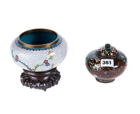 A LATE 19TH CENTURY JAPANESE CLOISONNE ENAMEL JAR AND COVER with floral panels to the shoulders, 4 1/4 ins diameter and a Chi