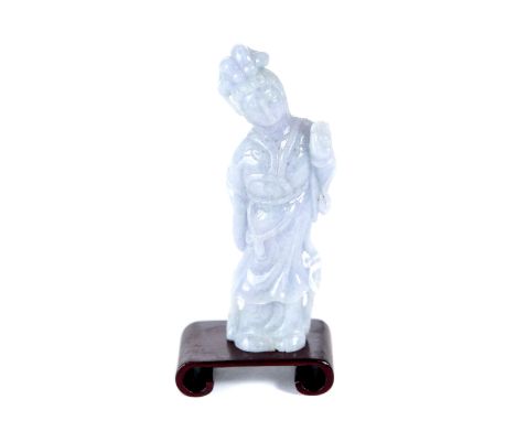 A CHINESE LAVENDER JADE FIGURE OF GUANYIN, 4 1/4 ins high with scrolled wooden stand.   £100-£150