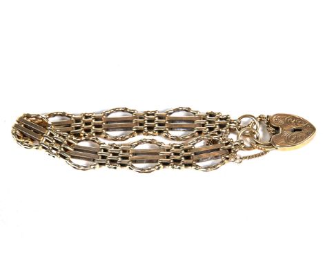 A LADY'S 9CT GOLD GATE STYLE BRACELET with engraved padlock clasp, stamped 375, approximately 19.9 grams.   £200-£250