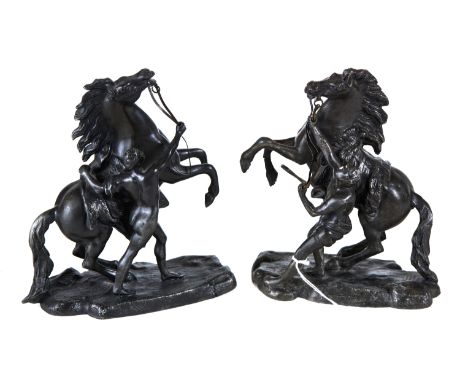 A PAIR OF LATE 19TH CENTURY SPELTER MARLY HORSES and attendants, after R. COUSTOU, 7 3/4 ins high.   £25-£40