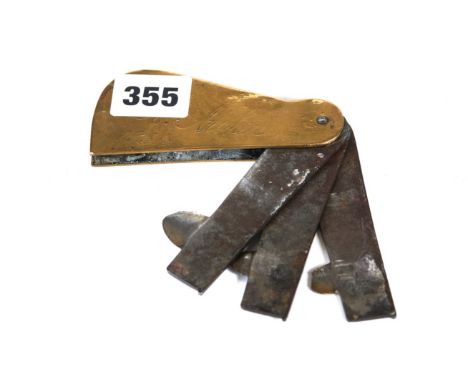 A 19TH CENTURY THREE BLADE VETS FLEAM, stamped Holmes, Derby, the brass sides inscribed R. Archer, 1834, 4 ins long.   £30-£5