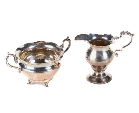 AN EDWARD VIII SILVER CREAM JUG with leaf capped handle, maker:- D &amp; JW, London 1936 and a small silver double handled SU