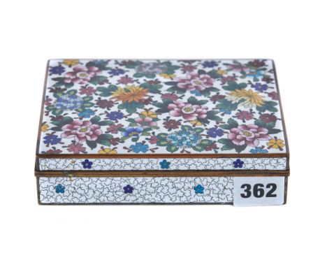 A JAPANESE CLOISONNE ENAMEL BOX of rectangular form decorated with floral sprays, 6 ins x 4 3/4 ins.   £120-£180