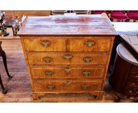 AN 18TH CENTURY WALNUT VENEERED CHEST OF DRAWERS, the moulded edge top above two short and three long graduated drawers with 