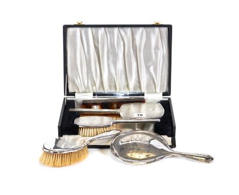 A GEORGE VI SILVER ENGINE TURNED THREE-PIECE DRESSING TABLE SET comprising:- Mirror, hair brush and comb, Birmingham 1947 (bo